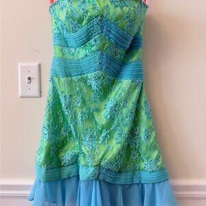 Maggie Sottero Lace overlay  and Bejeweled Green and Blue Mini Dress.